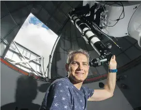  ?? JASON PAYNE/PNG ?? Howard Trottier is a professor of physics at Simon Fraser University, where he is pictured at the Trottier Observator­y and Science Courtyard.