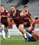  ?? ?? Braydon Ennor heads into space during Canterbury’s 27-21 win over Otago in their NPC match on Saturday night.