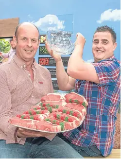  ??  ?? Graham Robertson with son Gary and their trophy and winning steaks.