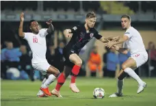 ?? Reuters ?? England’s Raheem Sterling, left, and Jordan Henderson held Ivan Rakitic and Croatia to a goalless draw on Friday