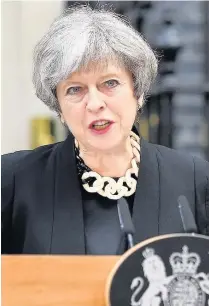  ??  ?? > Prime Minister Theresa May addresses the media as she makes a statement outside No10 Downing Street in response to Saturday night’s attacks