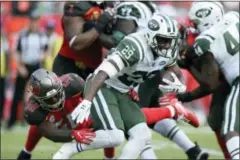  ?? JASON BEHNKEN — THE ASSOCIATED PRESS ?? New York Jets running back Bilal Powell (29) is stopped by Tampa Bay Buccaneers middle linebacker Kwon Alexander during the second half of an NFL football game Sunday in Tampa, Fla.