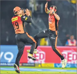  ??  ?? Sunrisers Hyderabad bowler Siddarth Kaul celebrates with a teammate after dismissing Mumbai Indians batsman Evin Lewis (unseen) during their IPL match in Hyderabad on Thursday.