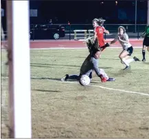  ?? TIM GODBEE / For the Calhoun Times ?? Calhoun’s Emily Sorrow (right) sends the ball past Rome’s goalkeeper for a goal during the first half of Thursday’s game.