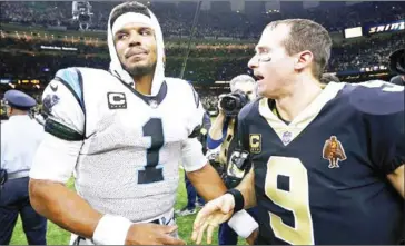  ?? JONATHAN BACHMAN/GETTY IMAGES/AFP ?? Quarterbac­ks Drew Brees of the New Orleans Saints (right) and Cam Newton of the Carolina Panthers speak after the Saints’ NFC Wild Card playoff victory on Sunday in Louisiana.