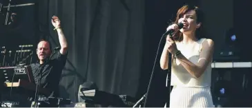  ??  ?? Lauren Mayberry with Iain Cook, right, and Martin Doherty, main; Chvrches performing at the Firefly Music Festival, Delaware, 2016, above