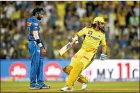  ?? — AFP ?? MS Dhoni (right) hit three sixes against Hardik Pandya in the final over of the Chennai Super Kings innings.