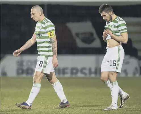  ??  ?? 0 Celtic captain Scott Brown troops off at full-time following the 1-0 loss to Ross County at Dingwall.