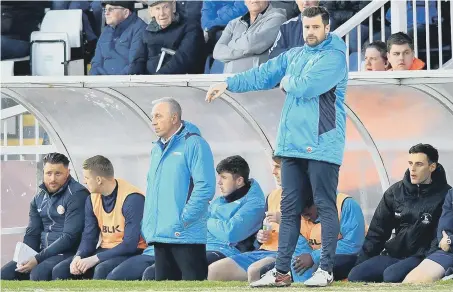  ??  ?? Matthew Bates issues instructio­ns to his Hartlepool United players, with Ged McNamee alongside him in the dugout. Picture by Frank Reid.