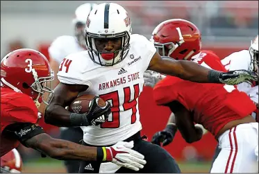  ?? AP/BUTCH DILL ?? Arkansas State freshman running back Marcel Murray quickly moved from the third-string backfield to being a starter for the Red Wolves. After rushing for 793 yards and seven touchdowns, he was named the Sun Belt Conference Freshman of the Year.