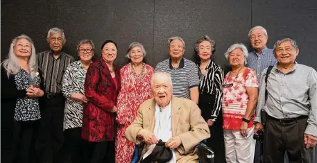  ?? Photos by Justin Rex / Contributo­r ?? Pat Hew, from left, Harry Gee, Jasmine Lim, Elise Huang Hall, Faye Chin, Daniel Loui, Sally Wong, May Ling Hew, Alfred Hew, Albert Ong and Henry Gee, front, gather for a reunion of the Dragoneers at the Asia Society Texas Center.