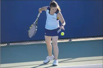  ?? Jesse Muñoz/ COC Sports Informatio­n Director ?? College of the Canyons tennis player Jenny Cranert prepares to serve during the Cougars’ home match vs. Antelope Valley College on Tuesday. COC won the event 9-0 to record the first victory in women’s tennis program history.