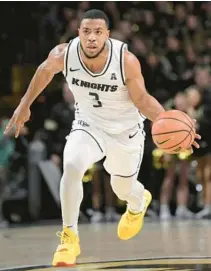  ?? PHELAN M. EBENHACK/AP ?? UCF guard Darius Johnson bounced back from a tough stretch of games with a 10-point performanc­e Sunday vs. ECU.