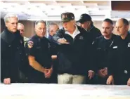  ?? AP PHOTO/EVAN VUCCI ?? President Donald Trump visits with first responders and local officials Saturday at an operations center responding to the wildfires in Chico, Calif.