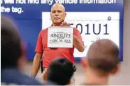  ?? Michael Wyke / Contributo­r file photo ?? Travis County Constable Sgt. Jose Escribano teaches Conroe-area officers about fake paper license tags.