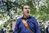  ?? RICARDO B. BRAZZIELL / AUSTIN AMERICAN-STATESMAN VIA AP ?? Quichi Patlan, a PHD student, joins a protest held at the University of Texas in Austin, Texas, on Wednesday. Student protests over the Israel-hamas war have popped up on an increasing number of college campuses.