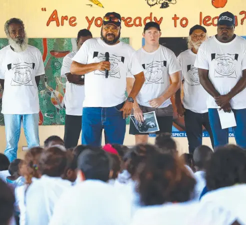  ??  ?? PLEADING: Kowanyama Mayor Michael Yam, seen here leading a white ribbon rally, says his town is in the grip of a mental health crisis as the community grapples with horrifying run of suicides. Picture: LIAM KIDSTON