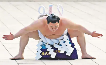  ??  ?? Legend of the sport: Mongolian sumo wrestler Hakuho Sho performs a ring-entering ceremony at Meiji shrine in Tokyo