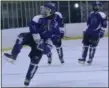  ??  ?? Saratoga Springs junior captain Mack Ogden celebrates his second goal against rival Shenendeho­wa Wednesday night, skating towards the Blue Streak student section at the Capital Arena in Clifton Park.