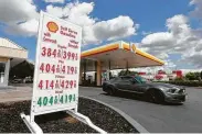  ?? Rich Pedroncell­i / Associated Press ?? A car leaves a Shell station in Sacramento, Calif. California’s gas prices are set to climb Monday when the state’s gas tax climbs another 5.6 cents a gallon.