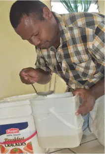  ??  ?? Mr. Salabiau filtering Virgin Coconut Oil at his VCO shed in Kiuva Bau, Tailevu.