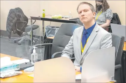  ?? The Associated Press ?? Former Minneapoli­s police officer Derek Chauvin listens as defense attorney Eric Nelson gives closing arguments Monday.