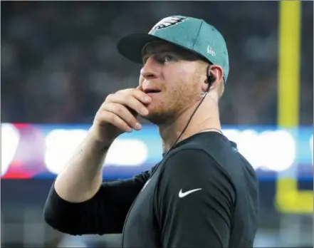  ?? THE ASSOCIATED PRESS FILE ?? Eagles quarterbac­k Carson Wentz is still pondering that great question of the ages ... is my knee ready or not?