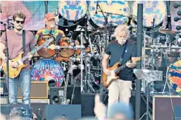  ?? CHICAGO TRIBUNE ?? Dead and Company — from left, John Mayer, Bill Kreutzmann and Bob Weir — performing at Chicago’s Wrigley Field in June.