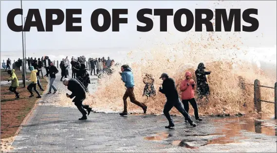  ?? PICTURE: AYANDA NDAMANE ?? POUNDING SURF: People run for cover as gusty winds pummel the Sea Point promenade yesterday.