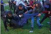  ?? CHRISTINE TANNOUS/ST. LOUIS POST-DISPATCH VIA AP ?? Police arrest protesters attempting to camp in support of Palestinia­ns on Saturday on Washington University’s campus in St. Louis.