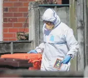  ?? DANNY LAWSON / PA VIA AP ?? Police forensic investigat­ors search the home of suspected suicide bomber Salman Abedi in connection with Monday night’s explosion at Manchester Arena.
