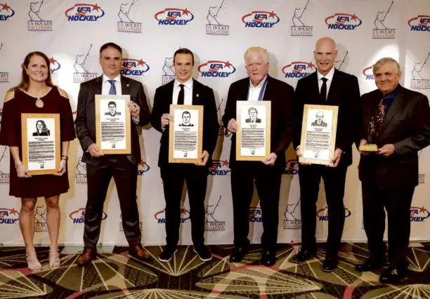  ?? MATTHEW J. LEE/GLOBE STAFF ?? The US Hockey Hall of Fame welcomed five new members: (from left) Katie King Crowley, Jamie Langenbrun­ner, Dustin Brown, Brian Burke, and Brian Murphy, as it honored Joe Bertagna (right) with the Lester Patrick Trophy at the Westin Copley Place Hotel.
