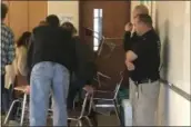  ?? GINGER RAE DUNBAR – DIGITAL FIRST MEDIA ?? Oxford High School teachers barricade the entrance to the classroom with desks during an active shooter drill.