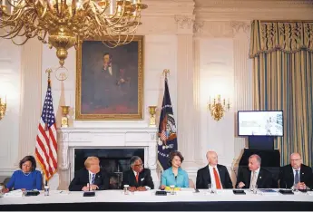  ?? CAROLYN KASTER/ASSOCIATED PRESS ?? New Mexico Gov. Susana Martinez, left, and other state and local officials meet with President Donald Trump, second from left, Monday at the White House to discuss transporta­tion infrastruc­ture issues.