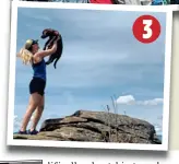  ??  ?? 2 On the road
Molly and Connor embrace in front of a tour bus
3 Great outdoors Molly on a hiking adventure where she cradles a dog on top of a rocky outcrop