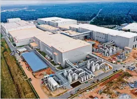  ?? COURTESY ?? SK Innovation, which already operates this massive EV battery plant in Jackson County, is partnering with Hyundai Motor Group on a new one in Bartow County.