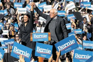  ?? Mary Altaffer / Associated Press ?? Bernie Sanders leaped back onto the campaign trail Saturday in Queens, N.Y., with a rally aimed at reassuring supporters unnerved by the 78-year-old’s recent heart attack. “I am more than ready to take on the greed and corruption of the corporate elite and the apologists,” Sanders said after earning an endorsemen­t from firebrand Rep. Alexandria Ocasio-Cortez. “To put it bluntly: I am back.”