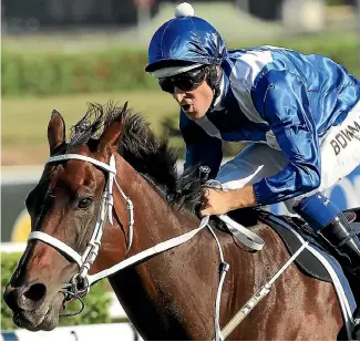  ?? PHOTO: GETTY IMAGES ?? Winx and jockey Hugh Bowman cruise home in the Queen Elizabeth Stakes at Randwick last Saturday.