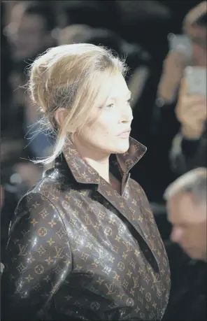  ??  ?? Increased demand for fashion brand Luis Vuitton, modelled by Kate Moss, helped the French luxury goods group LVMH to post record revenues in 2017.