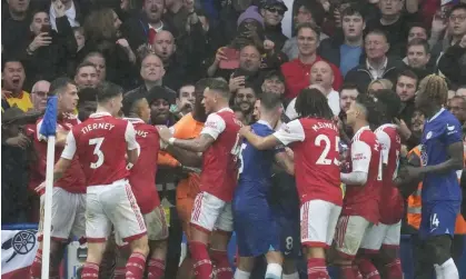  ?? ?? Chelsea and Arsenal players clash in the closing stages at Stamford Bridge. Photograph: Kirsty Wiggleswor­th/AP