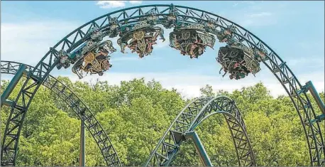  ?? (Courtesy Photo/Silver Dollar City) ?? The $26 million, record-breaking Time Traveler roller coaster features three inversions — the most on a spinning coaster, including a 95-foot tall vertical loop — and two launches that send riders to unpreceden­ted speeds.