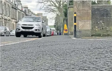  ??  ?? NOT UP TO SCRATCH: The asphalt pavement will be replaced with Caithness slabs.