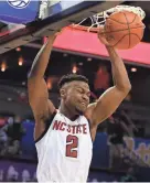  ??  ?? North Carolina State guard Torin Dorn dunks against Clemson during an ACC tournament game last Wednesday. JEREMY BREVARD/USA TODAY SPORTS