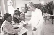  ??  ?? Chief minister of Tripura Manik Sarkar arrives to cast his vote.