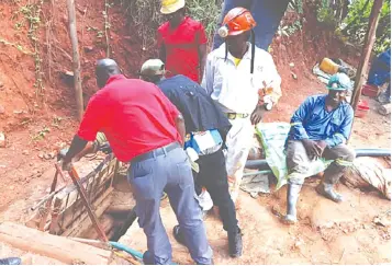  ?? — File Picture: Tinai Nyadzayo ?? A rescue team works on retrieving 15 artisanal miners who were trapped undergroun­d at Redwing Mine in Penhalonga, near Mutare in Manicaland Province recently