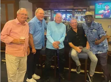  ?? PHOTO COURTESY OF WINE FAMILY ?? Former Phillies player and coach Bobby Wine, center, and fellow Phillies alumni Del Unser, Greg Luzinski, Larry Bowa and Gary Matthews pose for a photo during an alumni weekend party in August 2022.