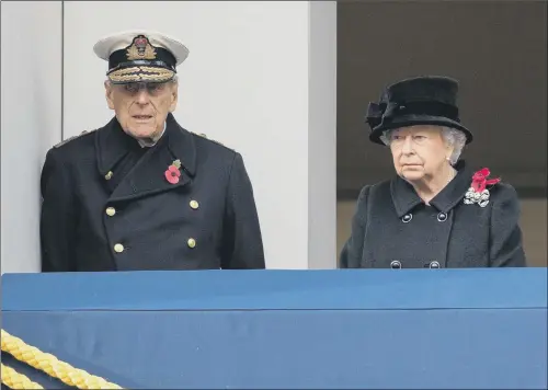  ?? PICTURE: PA. ?? SOLEMN DUTY: The Queen and the Duke of Edinburgh, observing the annual Remembranc­e Sunday Service at the Cenotaph as Prince Charles, inset, lays a wreath.