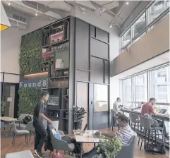  ?? BLOOMBERG ?? Members work at a co-working office space in Singapore which ranked the highest in terms of embracing the normalisat­ion of hybrid work and offering the flexibilit­y to employees to work anywhere and at any time.