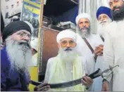  ?? HT PHOTO ?? Thakur Dalip Singh, head of Sirsa faction of the Namdhari Sect being honoured by Sikh activists outside the Golden Temple.