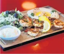  ?? MIKE STOCKER/SUN SENTINEL ?? The shrimp kebab platter at Sufrat Mediterran­ean Grill, a new restaurant in Pembroke Pines Florida.